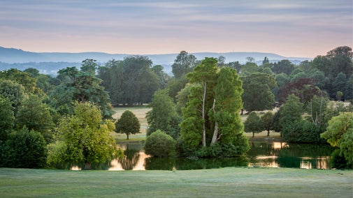The upper pond and grounds at Petworth House and Park in West Sussex